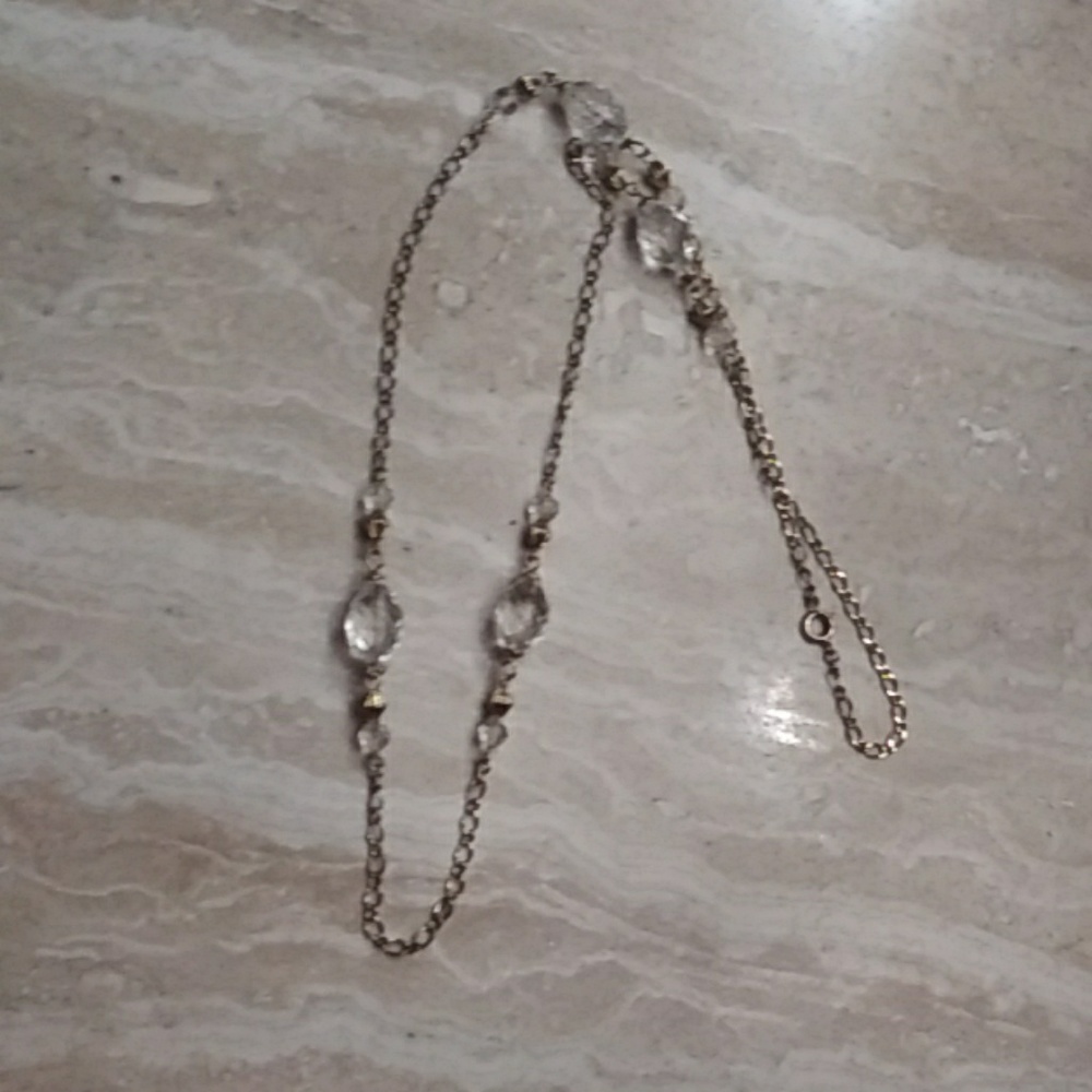 Gold tone necklace.